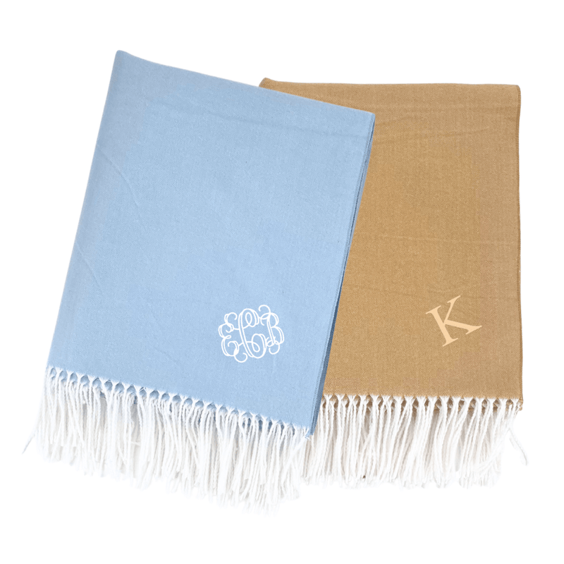 Blue and camel Monogrammed Woven Blankets with white fringe and personalized embroidery initials.