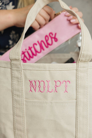 Needlepoint Canvas Project Tote with embroidered text detail, great for personalizing your bag.