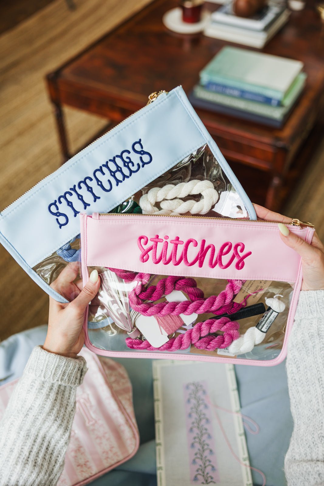 Personalized Needlepoint Clear Nylon Pouches in pink, blue, and white for organizing stitching essentials.
