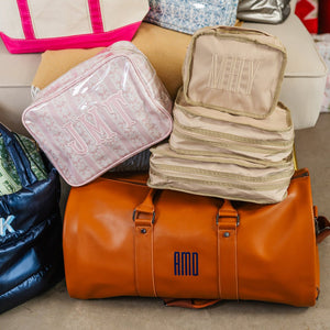 Custom nylon packing cubes in neutral tones, practical personalized travel gift.