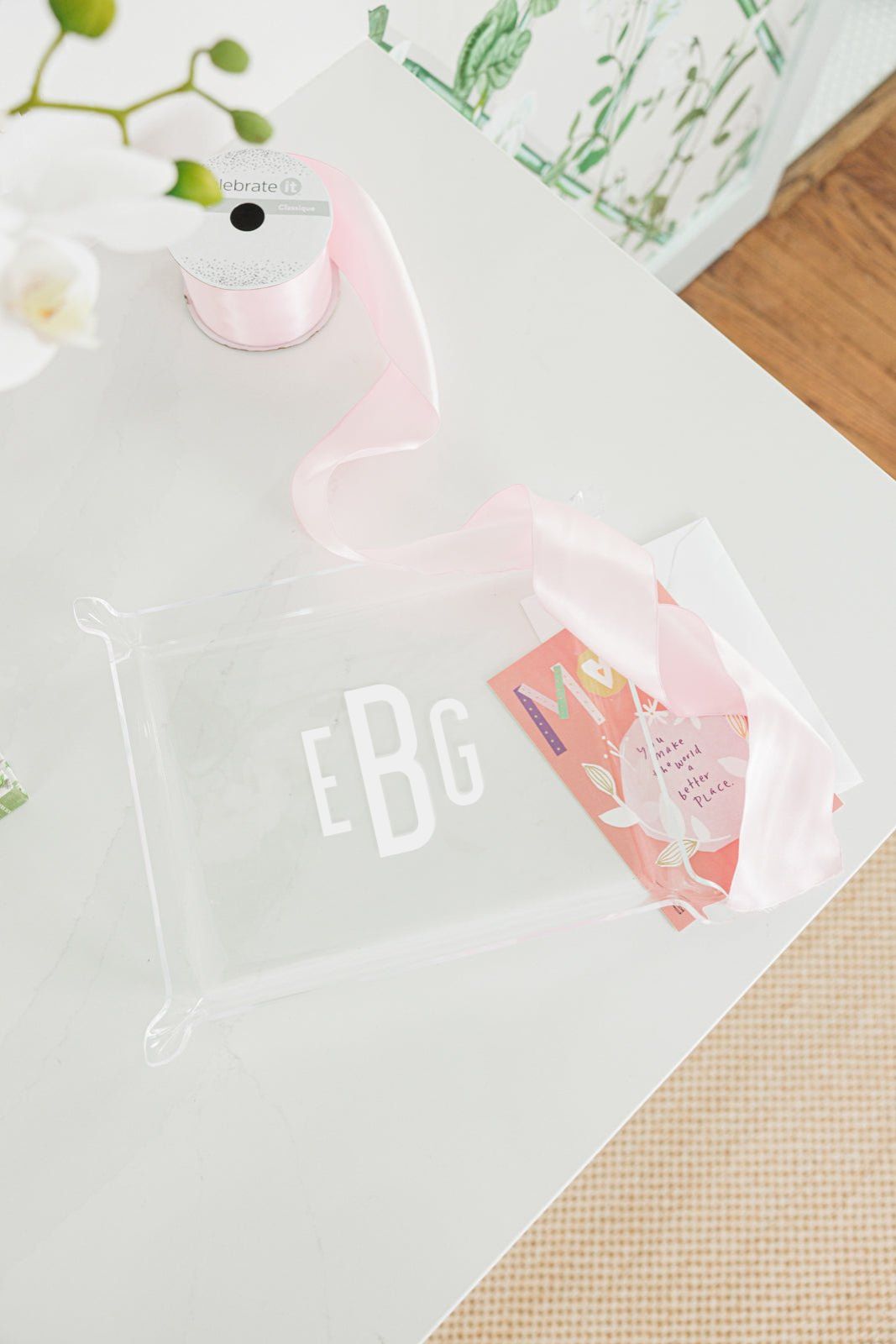 A set of two personalized acrylic trays featuring elegant monogrammed designs—one with the name 'WILLIAMS' and the other with initials 'EBG.' These chic and versatile catch-all trays add a stylish touch to any space, perfect for organizing small essentials on a desk, dresser, or entryway. Pair them with other custom acrylic accessories for a coordinated look