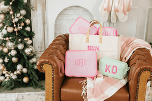 Personalized seersucker packing cube set with embroidered monograms, a travel essentials