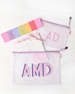 A small and large pool bag with a purple zipper are customized to match with purple monograms