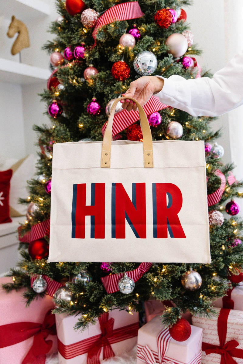 Shadow monogram weekender bag from Sprinkled With Pink styled under a Christmas tree, personalized travel tote gift idea