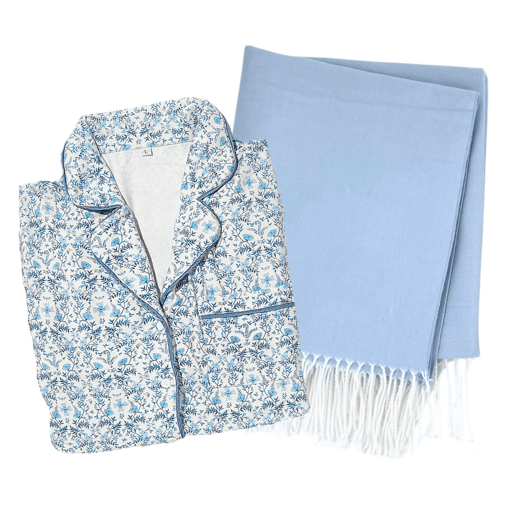 Blue floral pajama set styled with light blue Blanket/Pajama Bundle including white fringe accent.