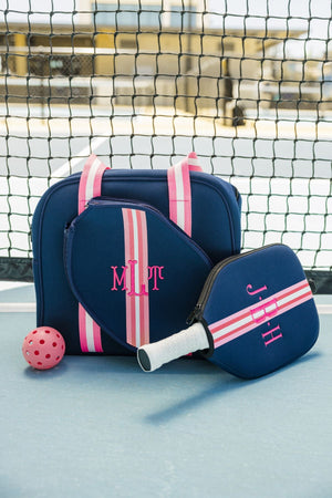 A navy and pink pickleball bag and paddle cover are customized with pink monograms