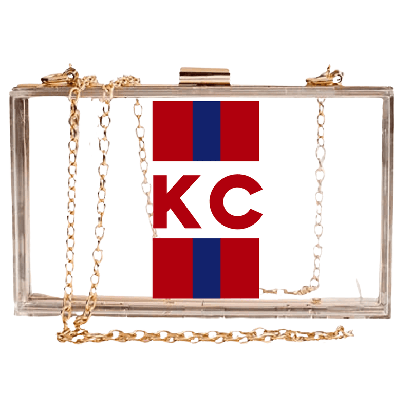 Clear stadium bag with purple stripes, bold “GB” monogram on front, and gold chain strap