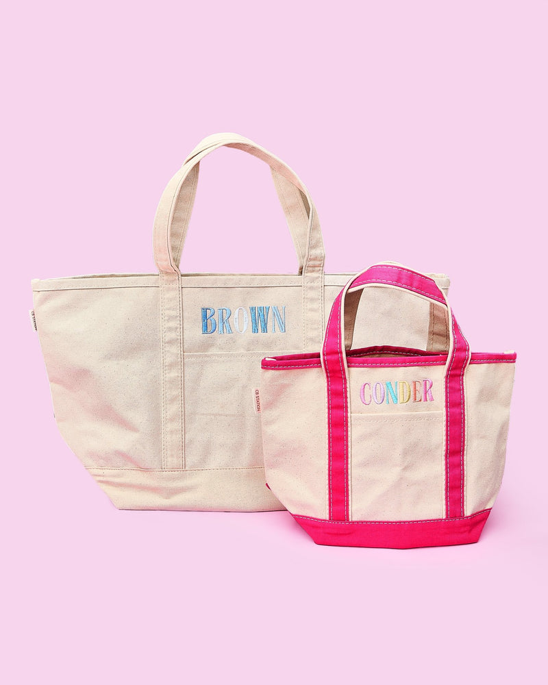 Two embroidered Teacher Canvas Totes – a large natural canvas tote with navy-blue trim and “BROWN” monogram, and a small natural tote with hot-pink trim and “CONDER” monogram