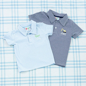 Two personalized baby polo shirts, one in light blue and the other in navy, both featuring subtle stripes and embroidered designs on the chest.