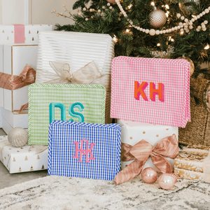 Personalized TRVL Roadie travel bag in pink and blue tones, custom toiletry bag.