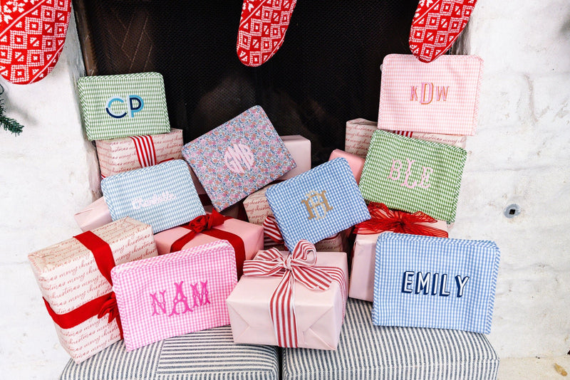 Personalized TRVL Roadie makeup bags with monogram, perfect for bridesmaids or travel.