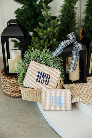 Neutral embroidered TRVL Roadie toiletry bag with initials, custom travel essential.