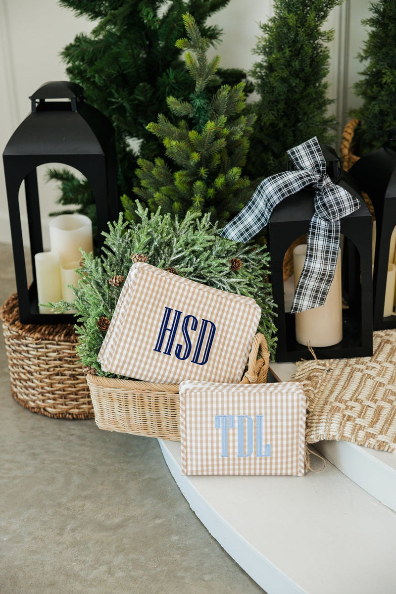 Neutral embroidered TRVL Roadie toiletry bag with initials, custom travel essential.