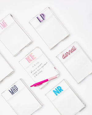 Multiple acrylic notepad holders with monograms and script