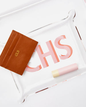 A custom cardholder sits in a personalized acrylic tray