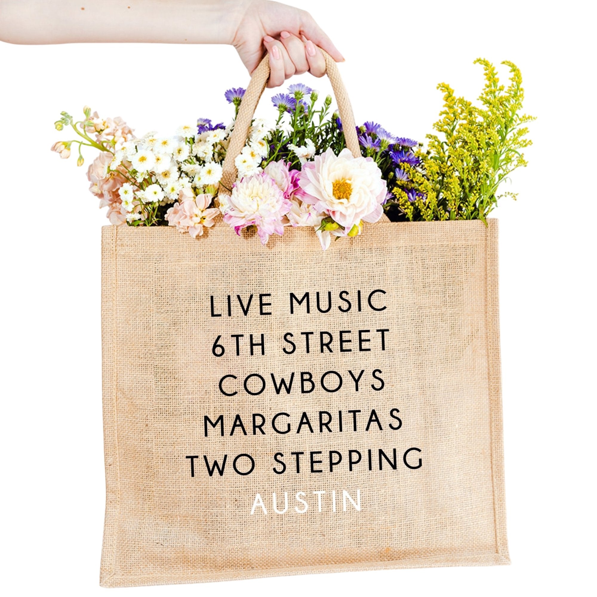 A jute carryall tote customized with sayings about Austin