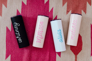 A few tumblers are customized with names in different fonts and colors.