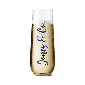 An acrylic champagne flute reads "Jones & Co." on the front