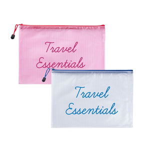 A pink and a white pool bag are customized with "travel essentials" in different colored script fonts.