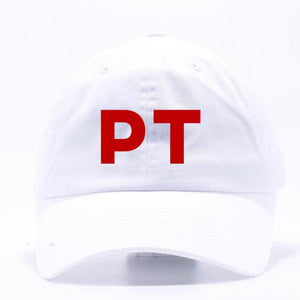 A white baseball hat with "PT" monogrammed on the front