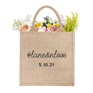 A jute tote is customized with a hashtag and date.