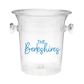 A clear ice bucket with "The Berkshires" on the front