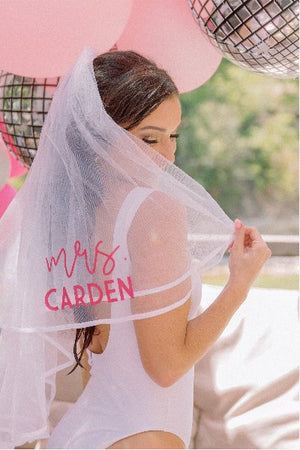 A woman wears a customized veil at her bachelorette party