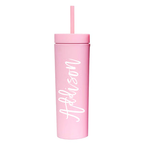 A matte pink tumbler with "Addison" on the front in cursive