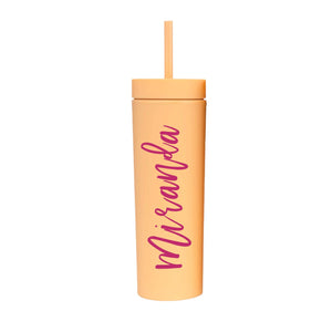 A matte orange tumbler with "Miranda" on the front in cursive
