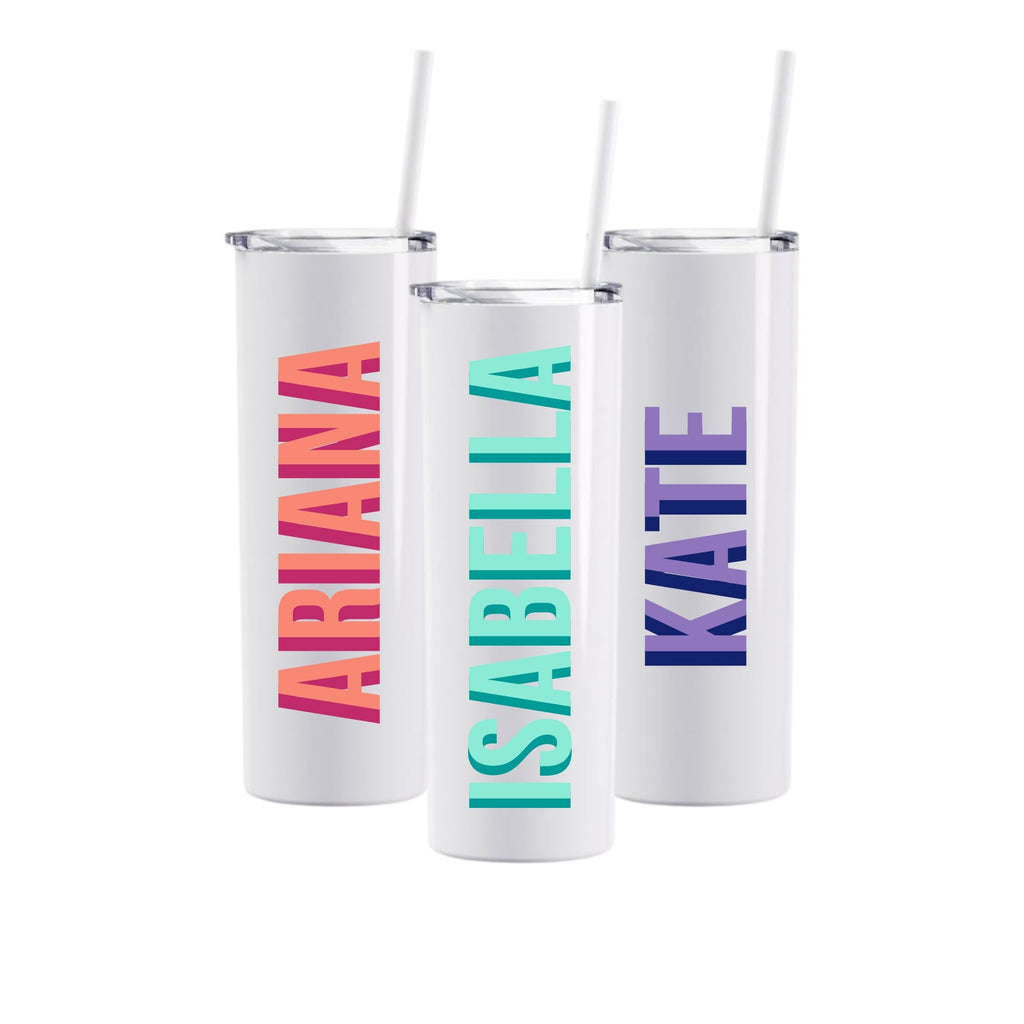 Three white tumblers are customized with names in different colors.