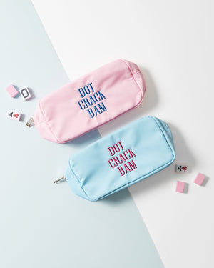 Two large nylon pouches in blue and pink with "Dot Crack Boom" embroidered on the front