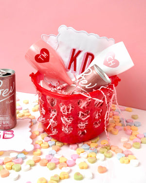 A basket of pink and red products is put together for Valentine's Day 