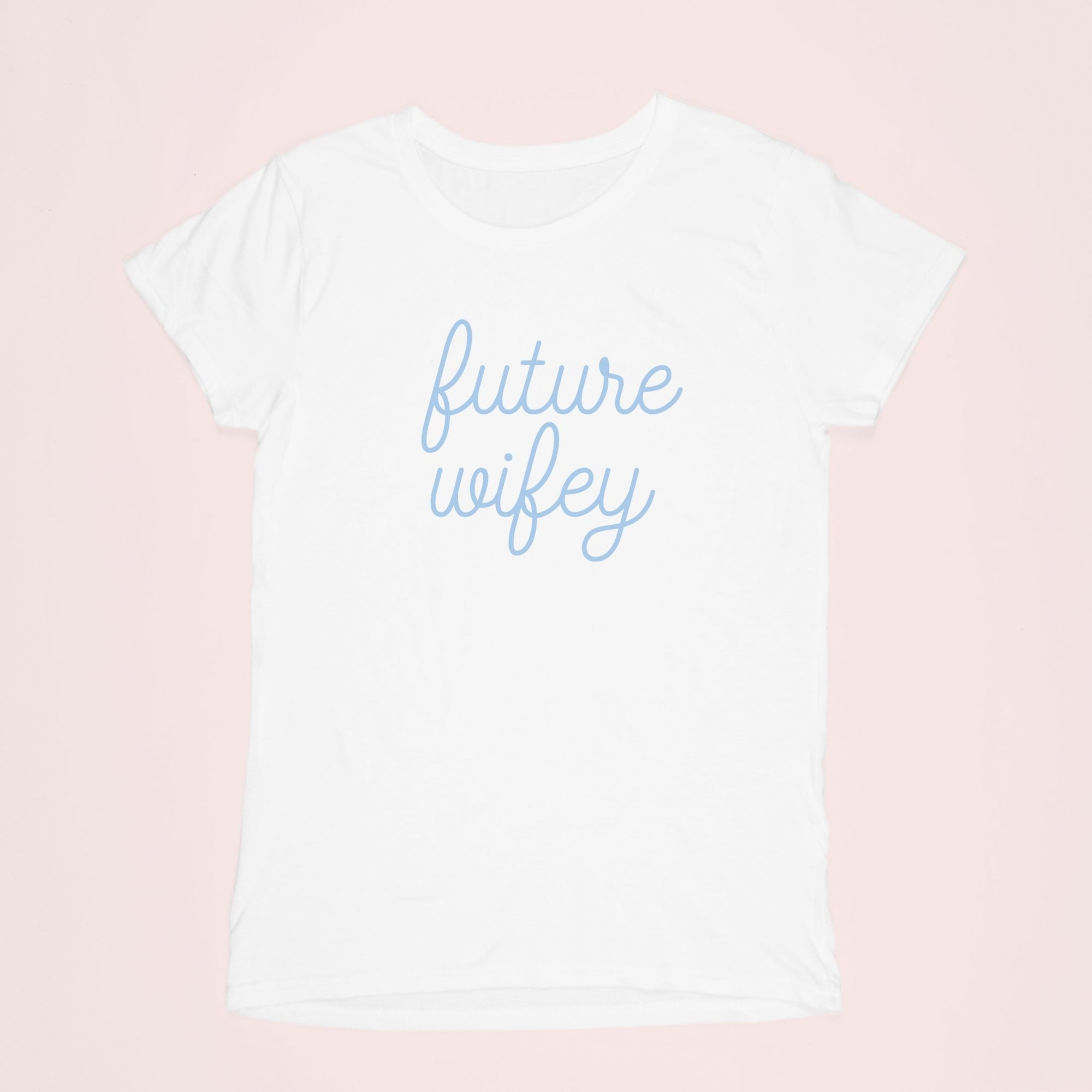 A shirt lays flat and shows off it's blue writing which reads "future wifey"