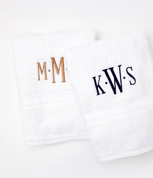 Two guest towels that feature embroidered monograms
