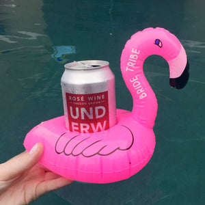 A pink flamingo pool drink float that says "bride tribe."