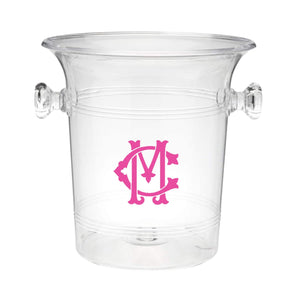 A clear ice bucket with "CM" monogrammed on the front in an interlocking format
