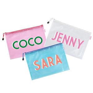 A pink, white, and a blue pouch are customized with names in different colors.