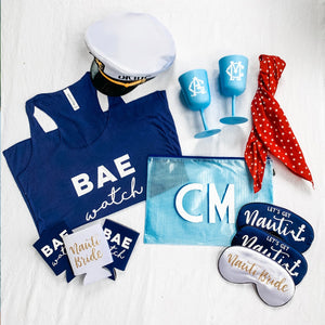 An assortment of products is laid out for a nautical themed bachelorette party.