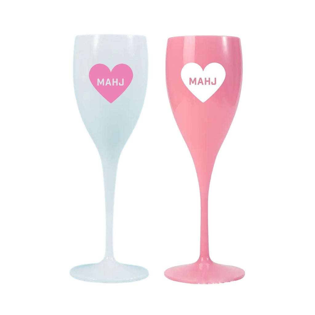 Two acrylic champagne flutes with a heart that reads 