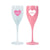 Two acrylic champagne flutes with a heart that reads "Mahj" one is white and one is pink