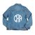 A denim jacket with a circle monogram on the back center reads "CRA"