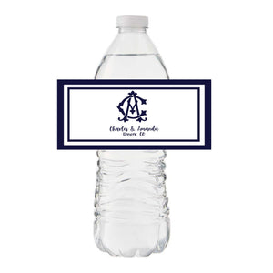 A water bottle is customized with a navy monogrammed label