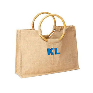 A bamboo jute is customized with a blue monogram 