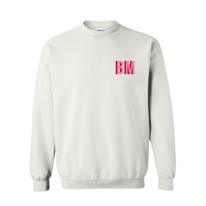 A white sweatshirt with "BM" monogrammed on the front chest