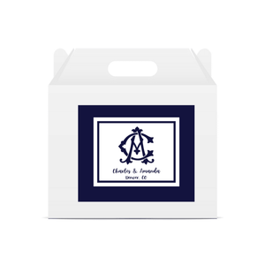 A favor box is customized with a navy monogrammed label