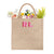 A custom jute bag has "RL" monogrammed on the front in pink