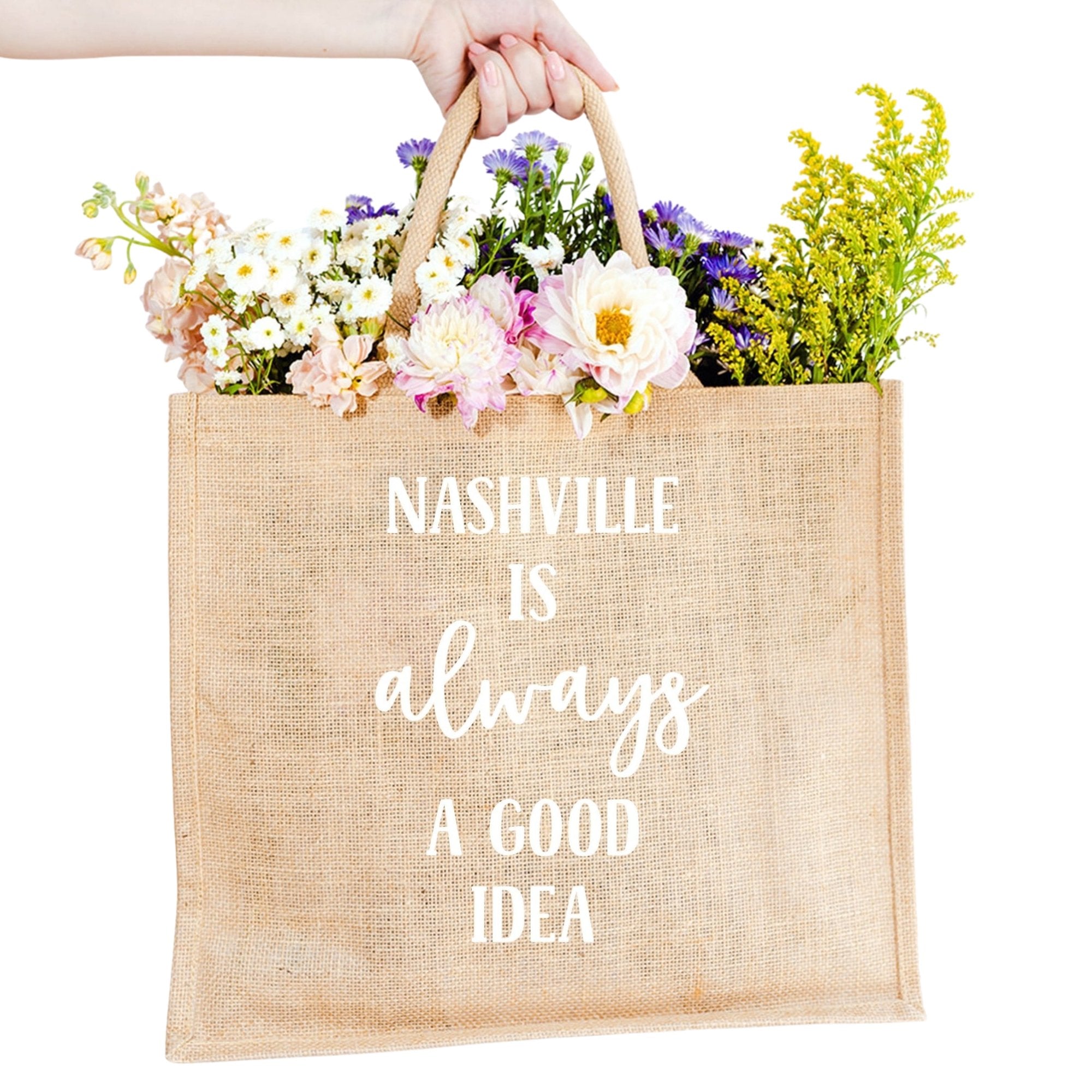 A custom jute bag reads "Nashville Is Always A Good Idea" on the front