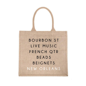 A jute carryall tote customized with sayings about New Orleans