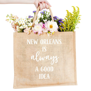 A custom jute bag reads "New Orleans Is Always A Good Idea" on the front