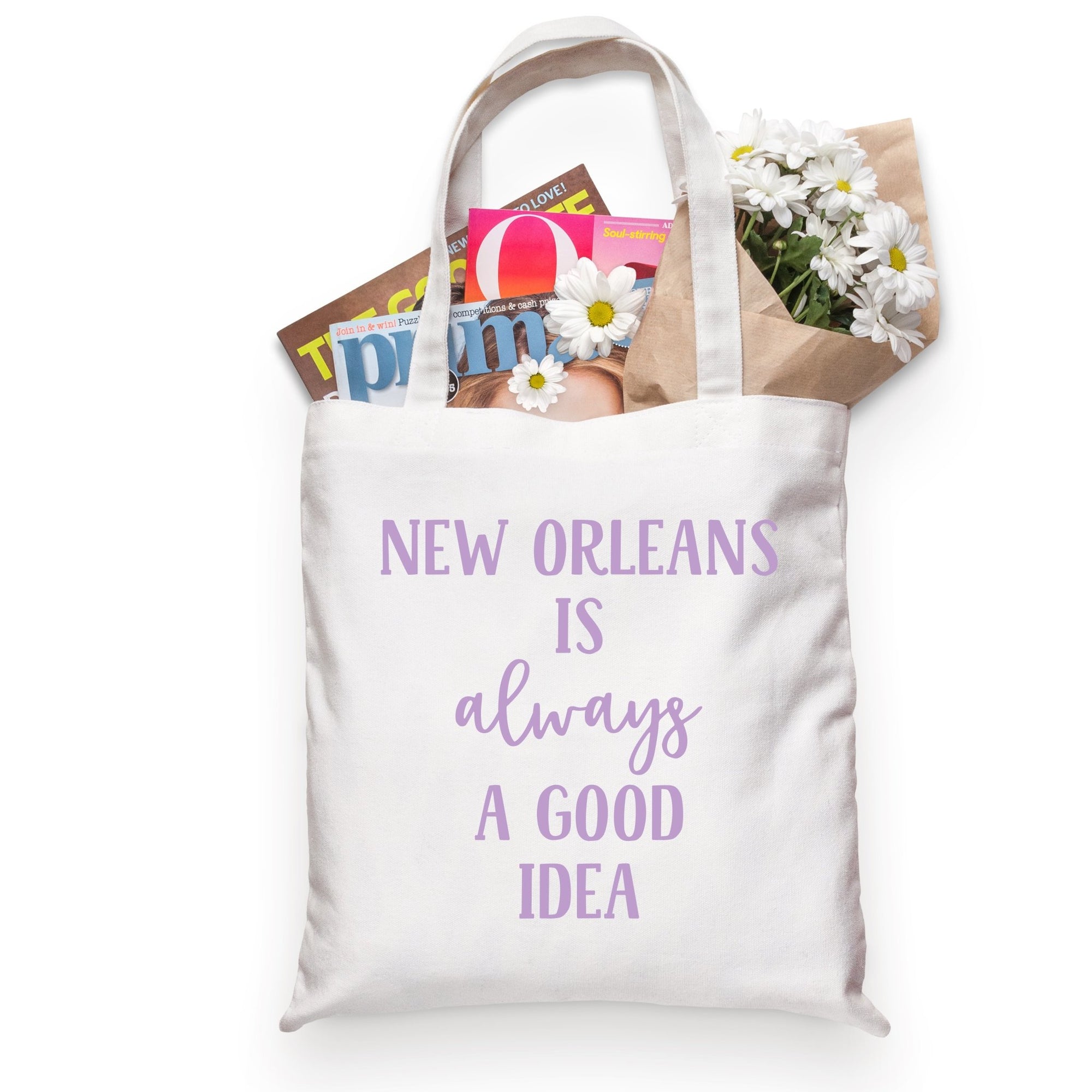 A cotton tote is customized with purple text that reads "New Orleans is always a good idea".